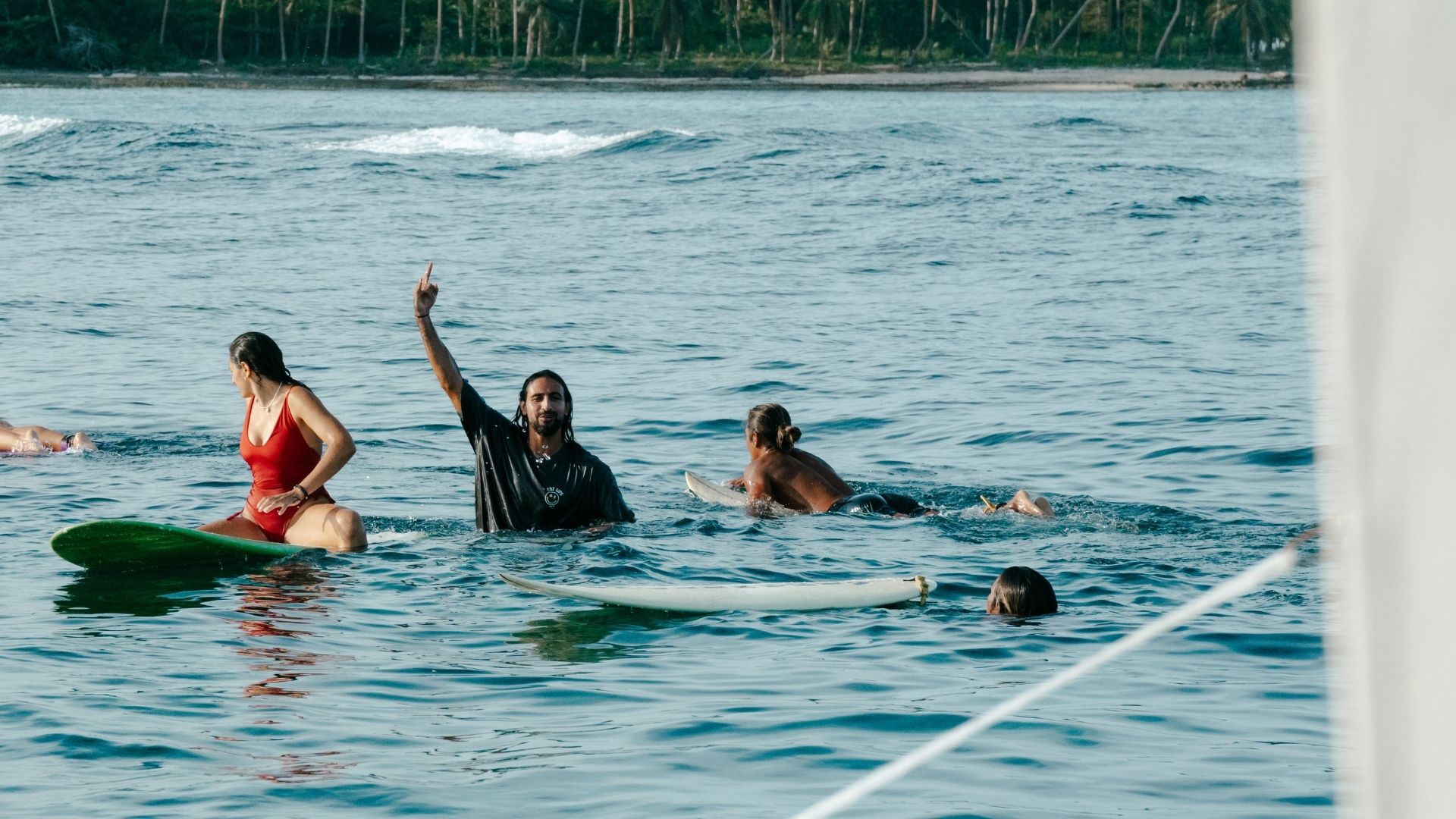 Guests in the water during surf retreat