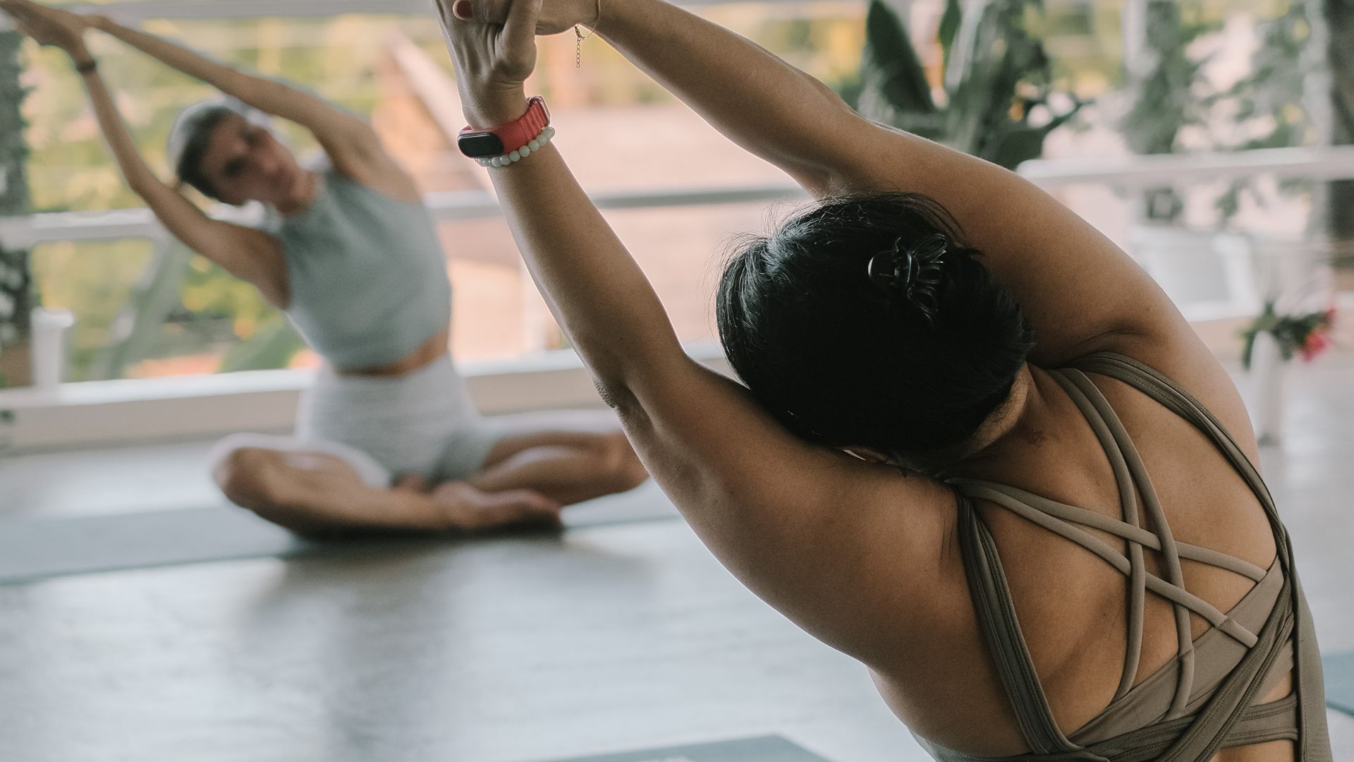 Guests practicing yoga in an open-air shala