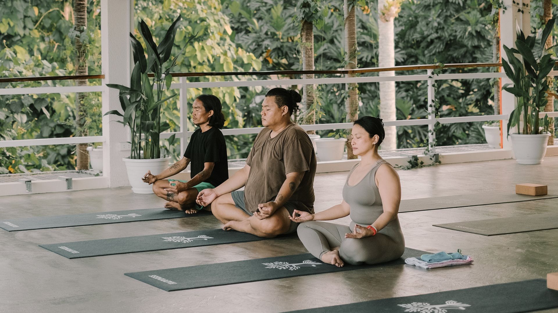 Guests meditating together after yoga